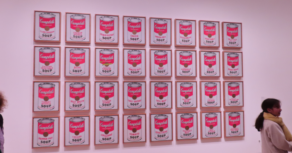 Andy Warhol's Campbell's Soup Cans displayed in a gallery at the Museum of Modern Art.
